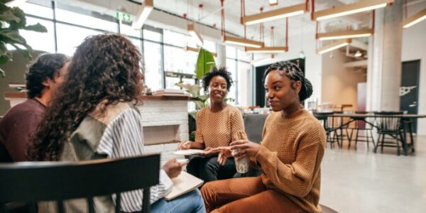women talking in an open plan space